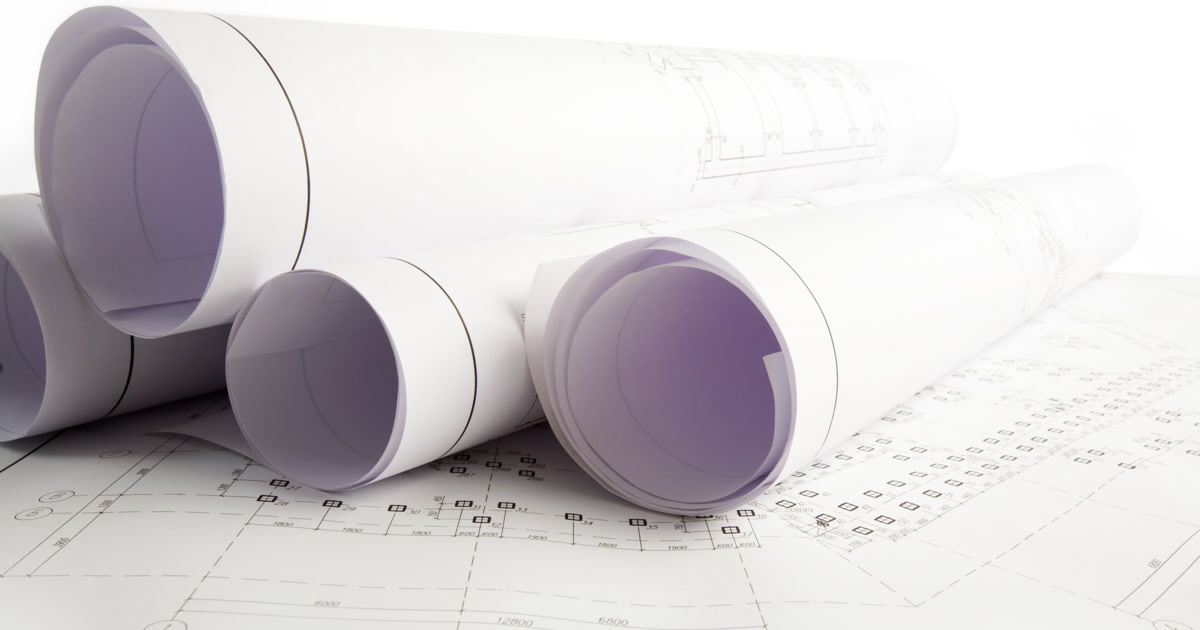 Close-up of architectural blueprints with project sketches